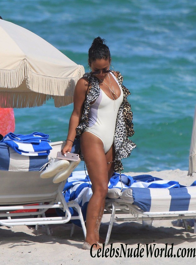 Christina Milian Pokies In White Swimsuit On The Beach 15859