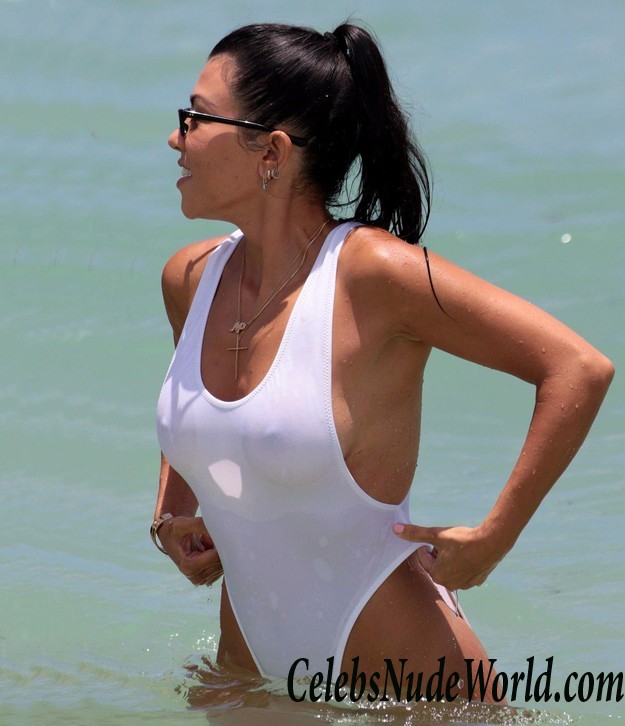 Kourtney Kardashian Pokies In White Swimsuit At The Beach In Miami 16969