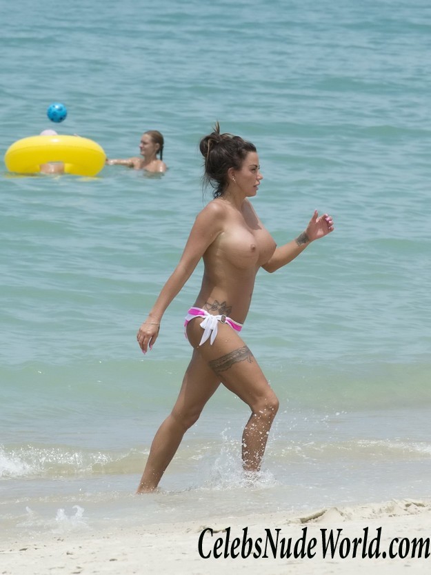 Katie Price exposing her big bare boobs at a beach 7325