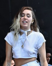 Miley Cyrus Braless On Stage At KTUphoria 2017