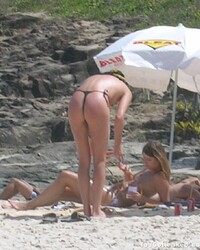 Charlize Theron topless on a beach