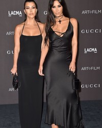 Busty Kardashian sisters in a skimpy black gowns