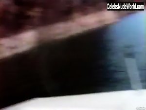 Pamela Anderson relaxing topless in a boat in Pam & Tommy Lee sex tape (1998) 11