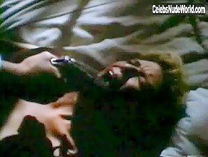 Kelly McGillis boobs , Blonde in Cat Chaser (1989) 16